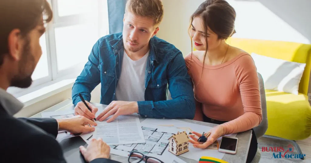 A couple discussing their home buying process with a buyers advocate, contemplating how long does it take to buy a home.