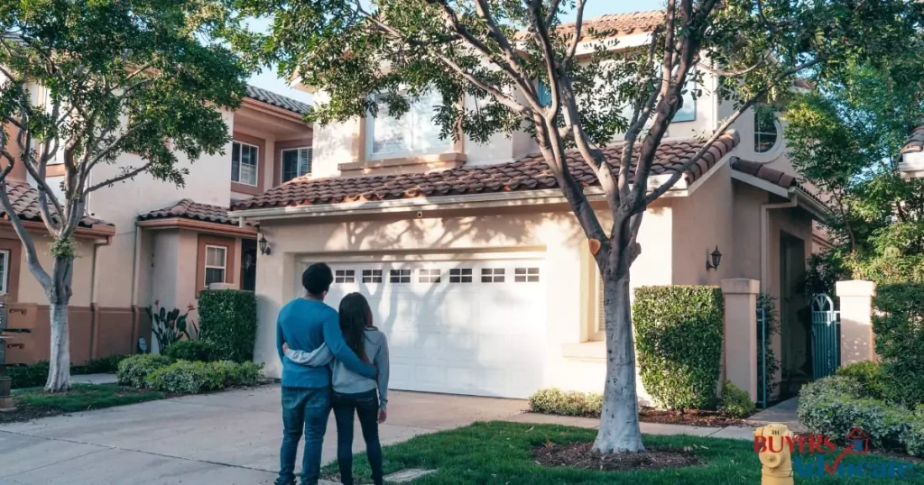 Young couple standing in front of a Melbourne home, symbolizing access to first home buyer grants and concessions available in Melbourne